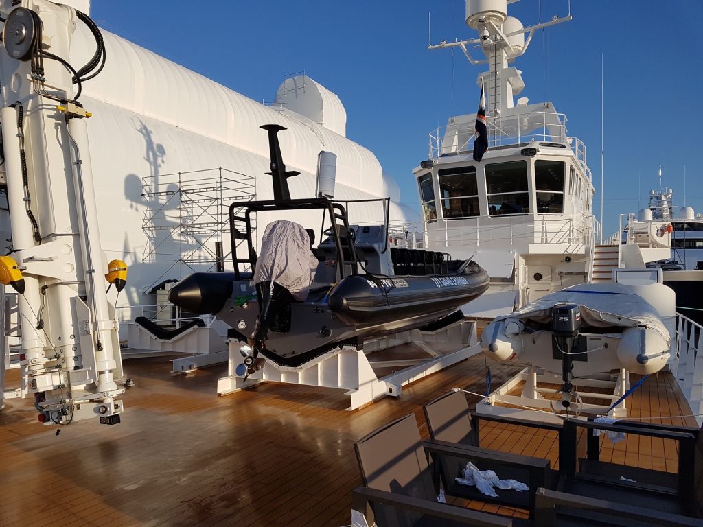 Support RIB beside the deck crane on the aft deck