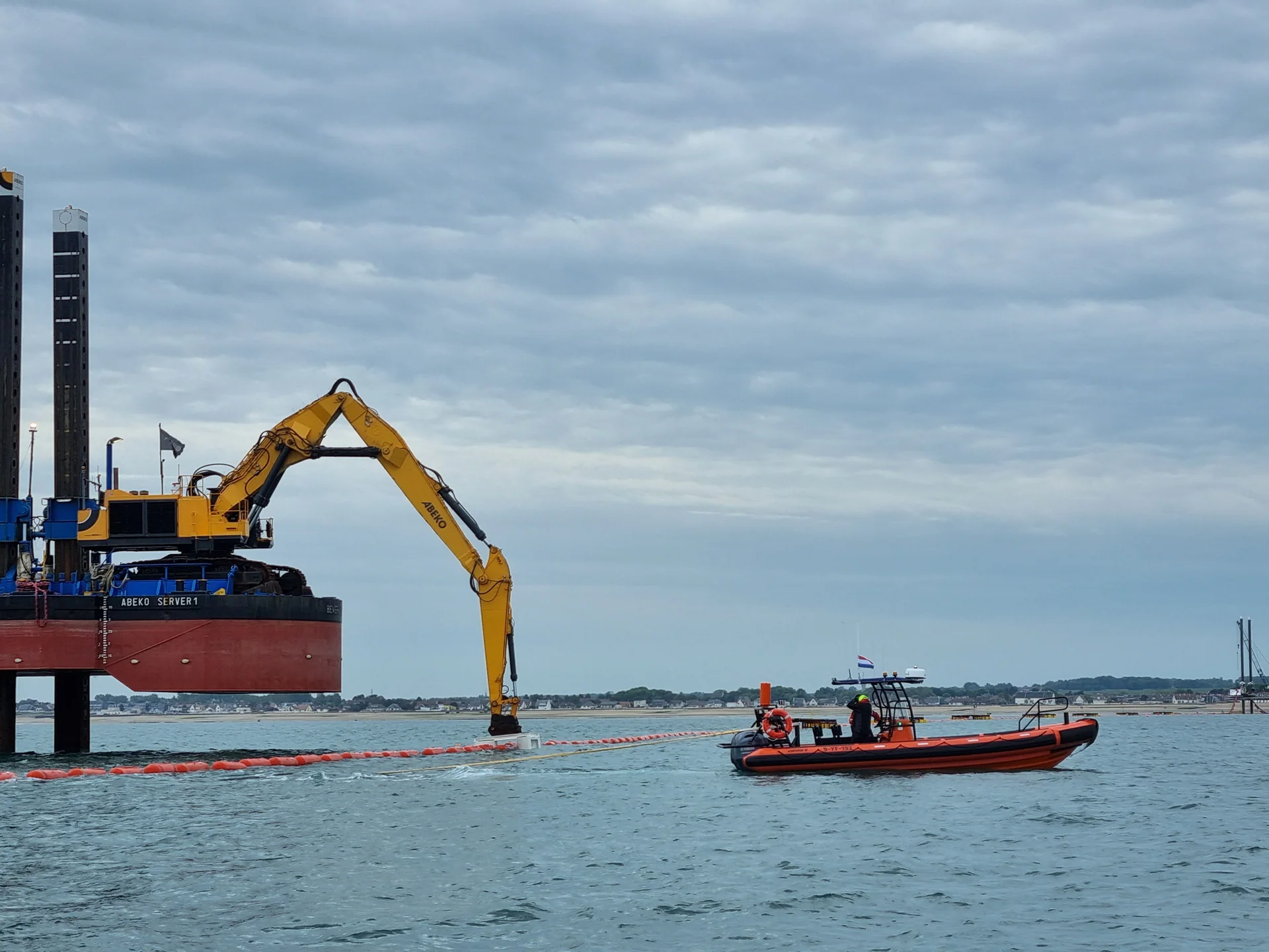 Novi Marine support RIB alongside a work platform during cable laying