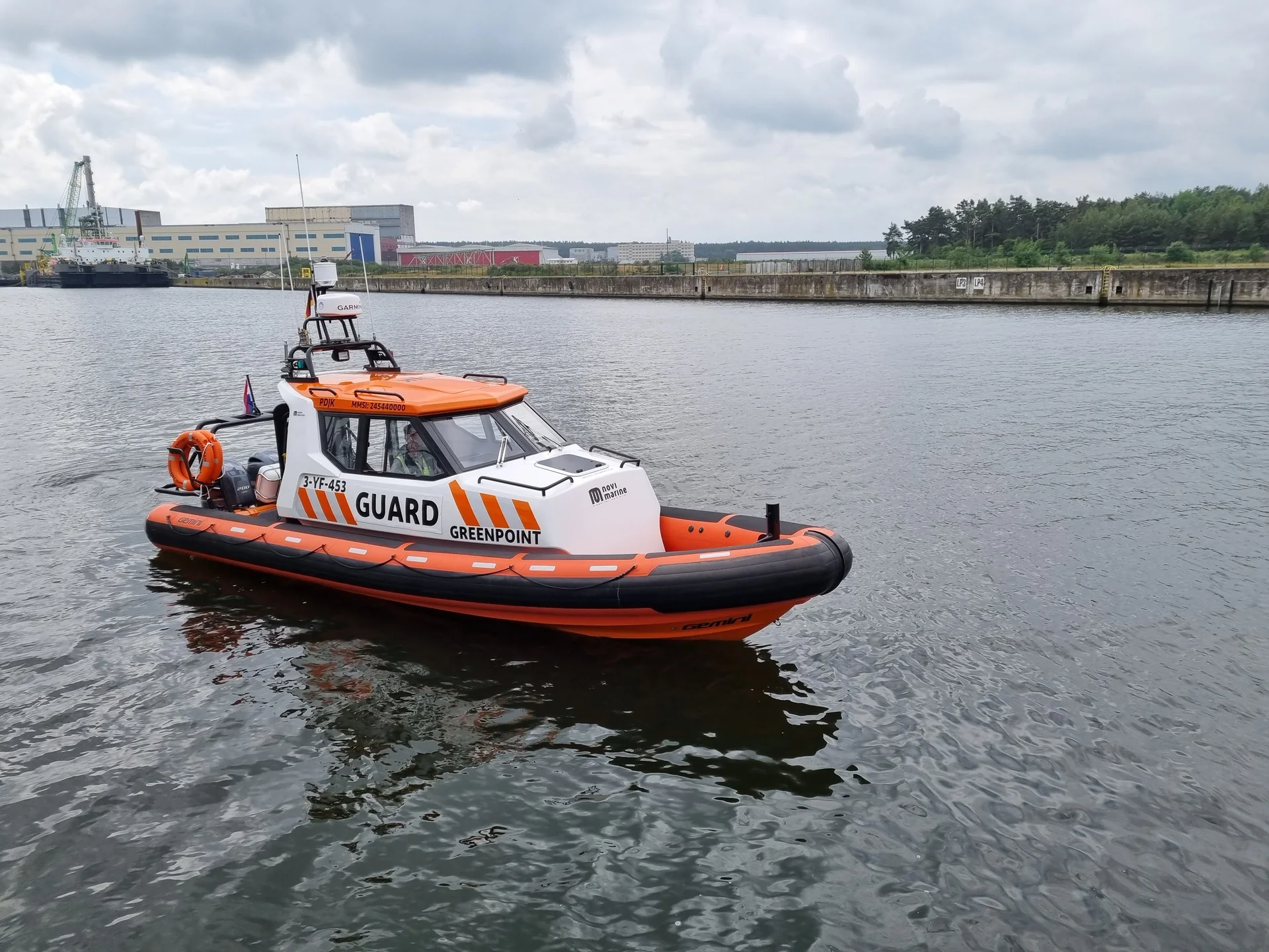Gemini Cabin RIB Greenpoint with an enclosed cabin in the harbour