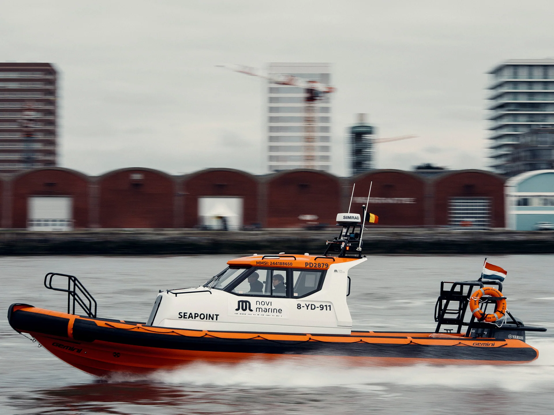 Gemini Cabin RIB Seapoint underway with an enclosed cabin and crew
