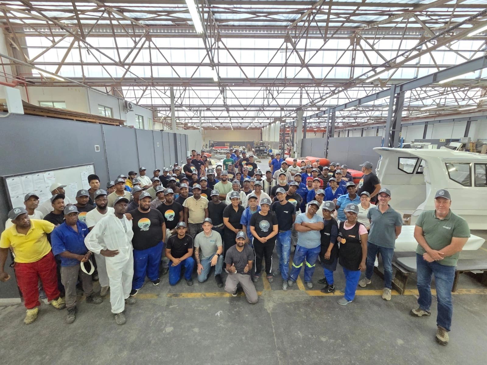 The Gemini Marine team at the factory celebrating ten years of the Novi Marine dealership