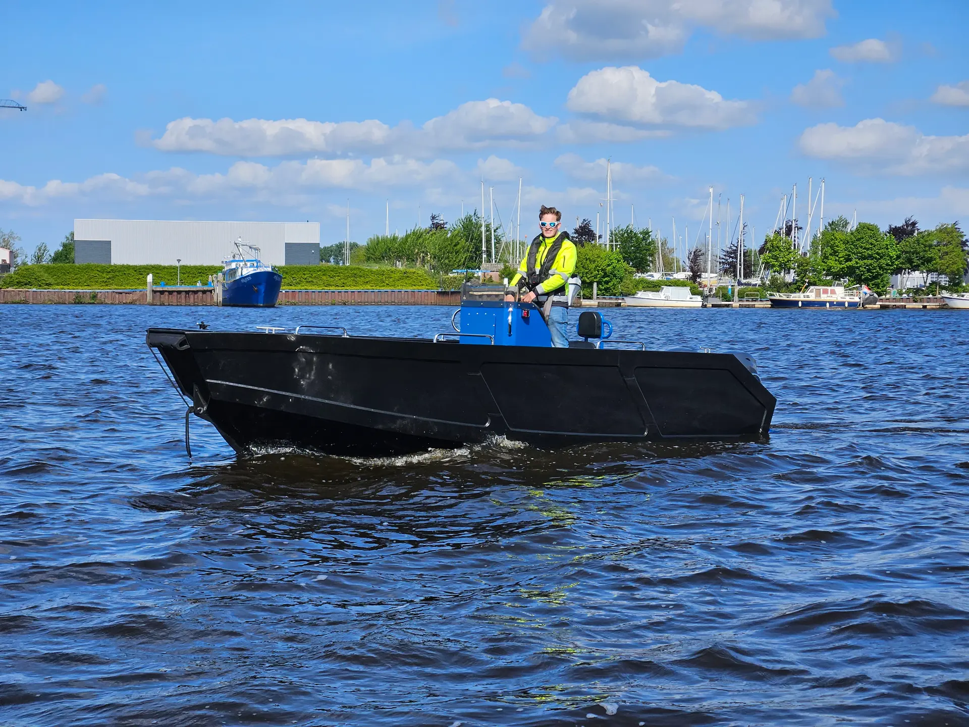 Side view of the Rhino Marine 600TT on the water